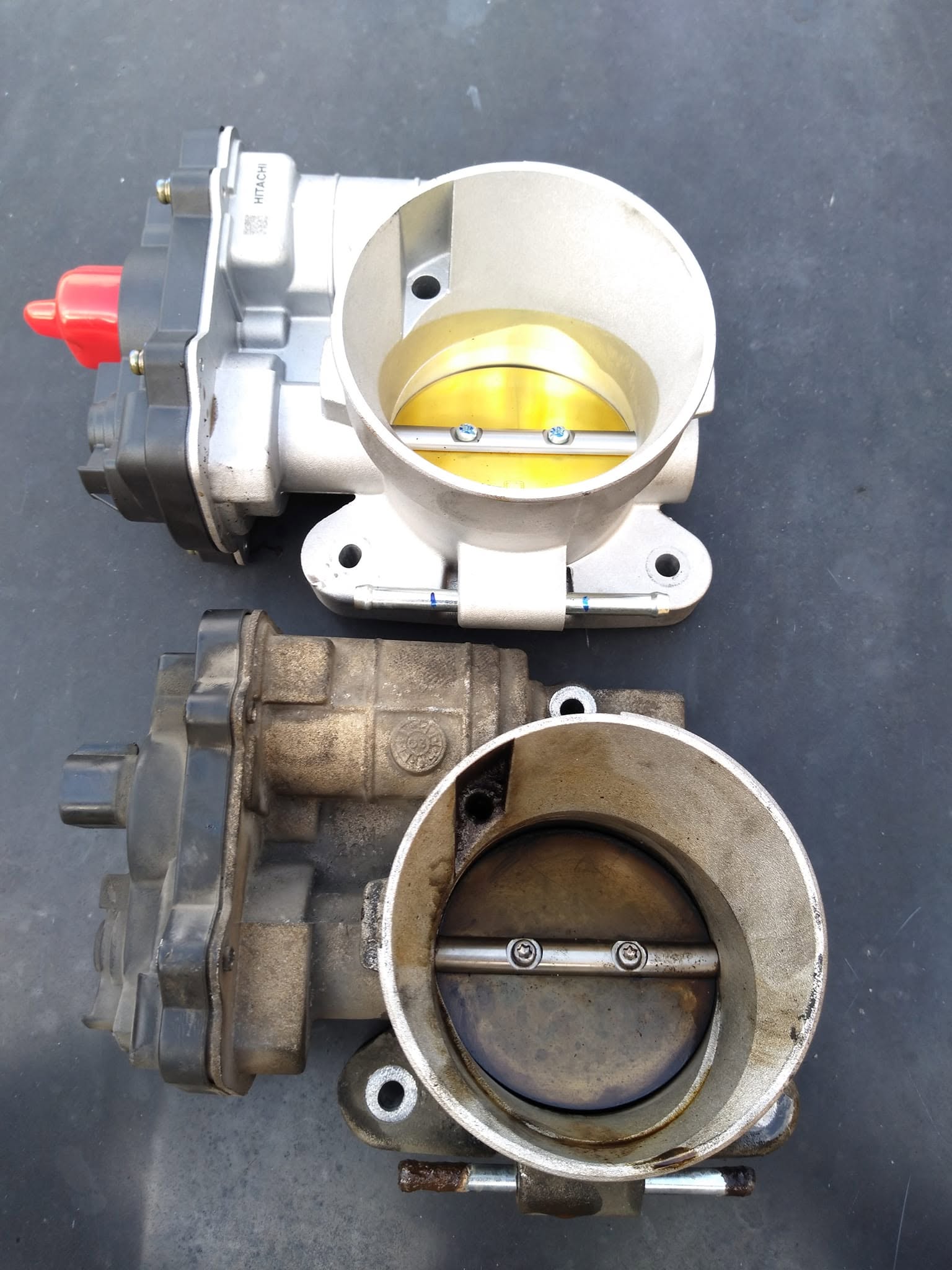 Two throttle bodies shown side by side