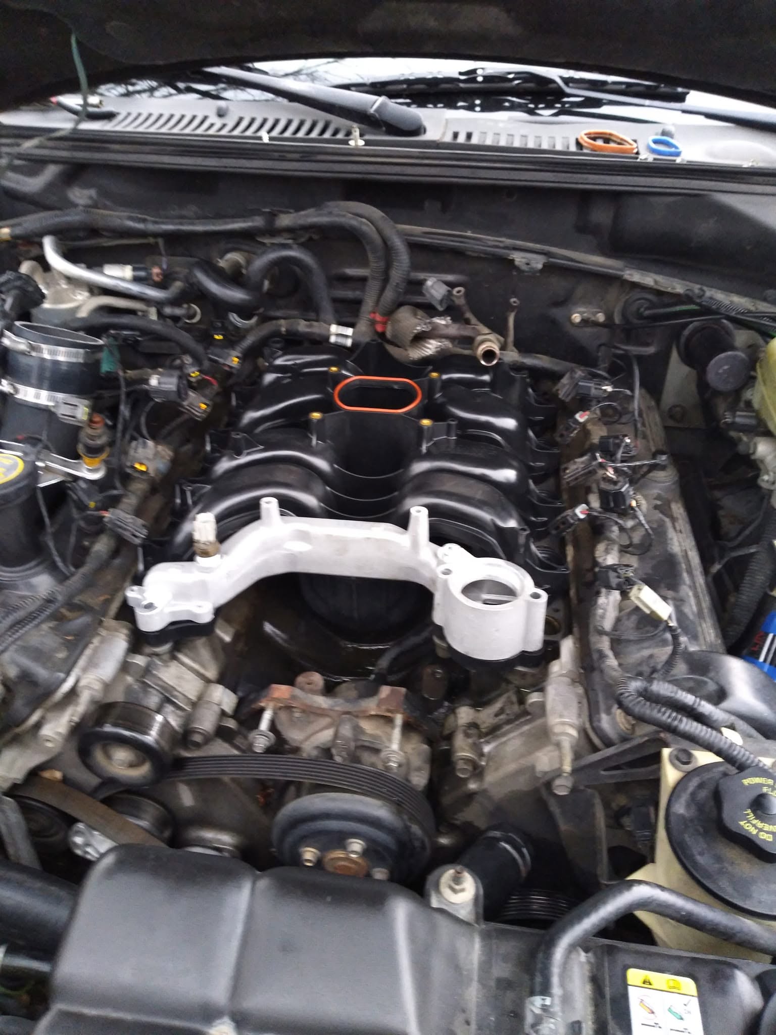 Vehicle engine bay with intake components