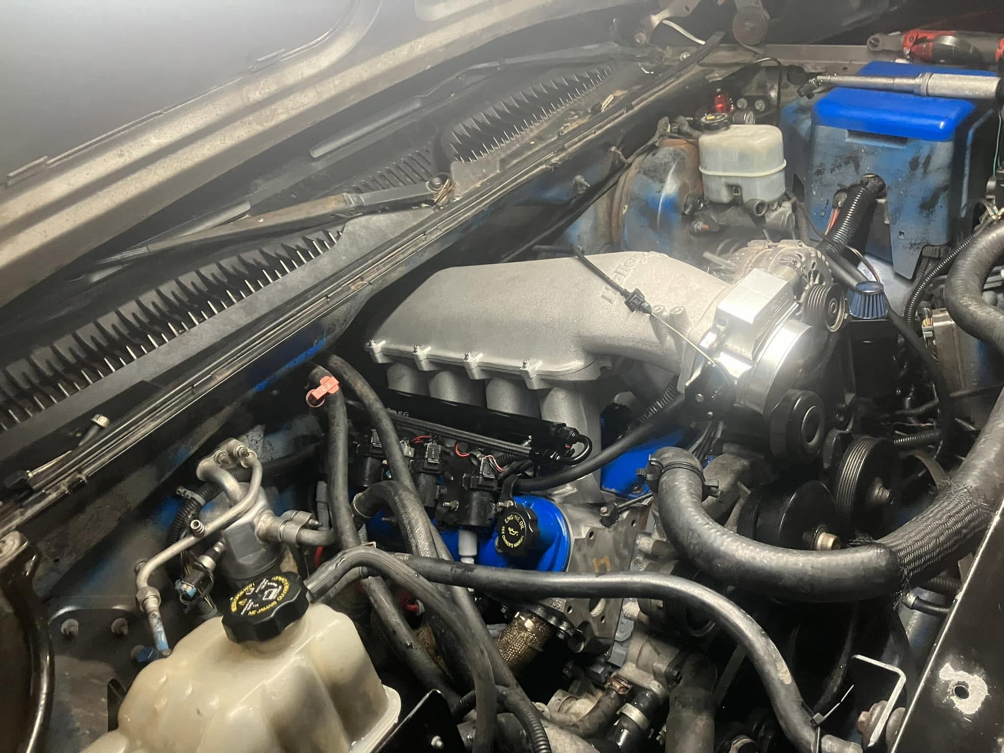 Engine bay with intake and accessory components