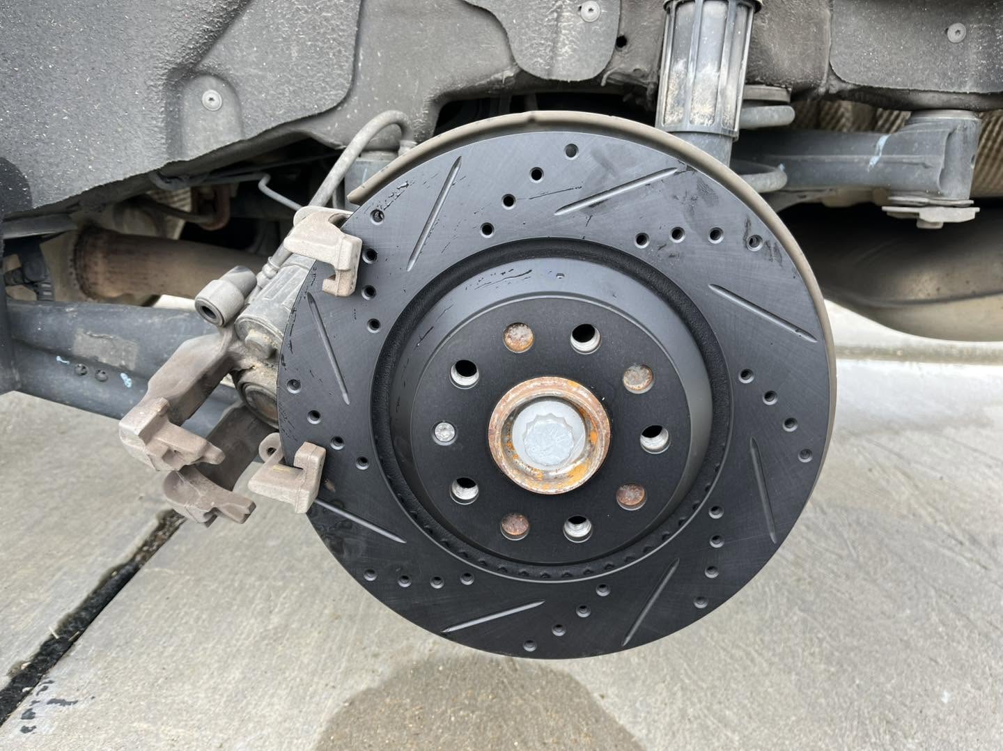 Drilled vehicle brake rotor
